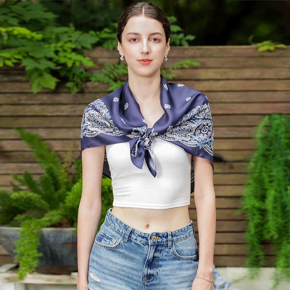 Close-up of the navy and white paisley silk scarf edge