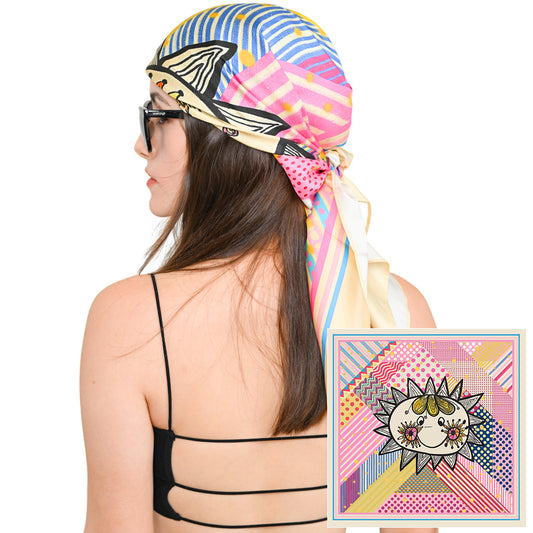 Woman wearing the colorful silk scarf as a head wrap