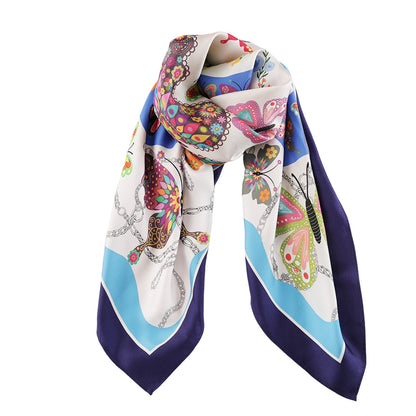 Draped view of the butterfly print silk scarf