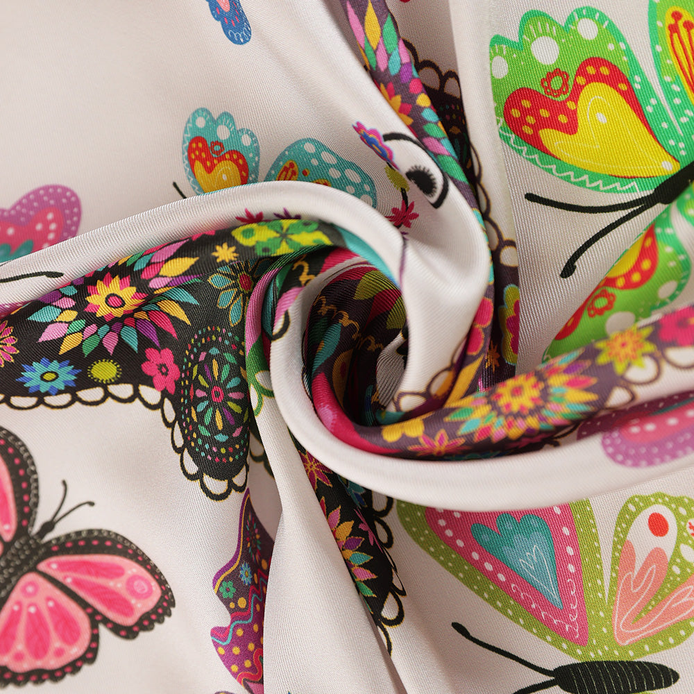 Close-up of the colorful butterfly print on silk