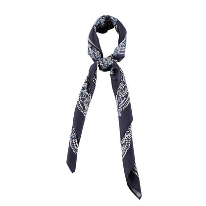 Navy and white paisley silk scarf styled around the neck