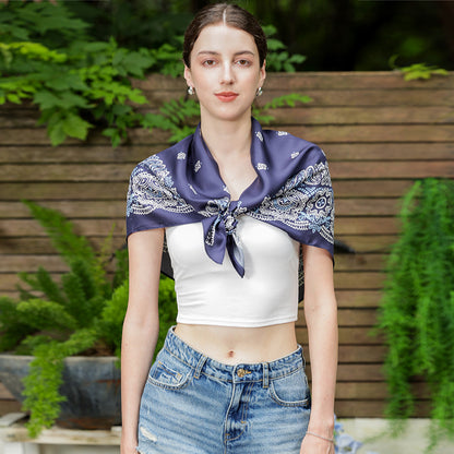 Close-up of the navy and white paisley silk scarf edge