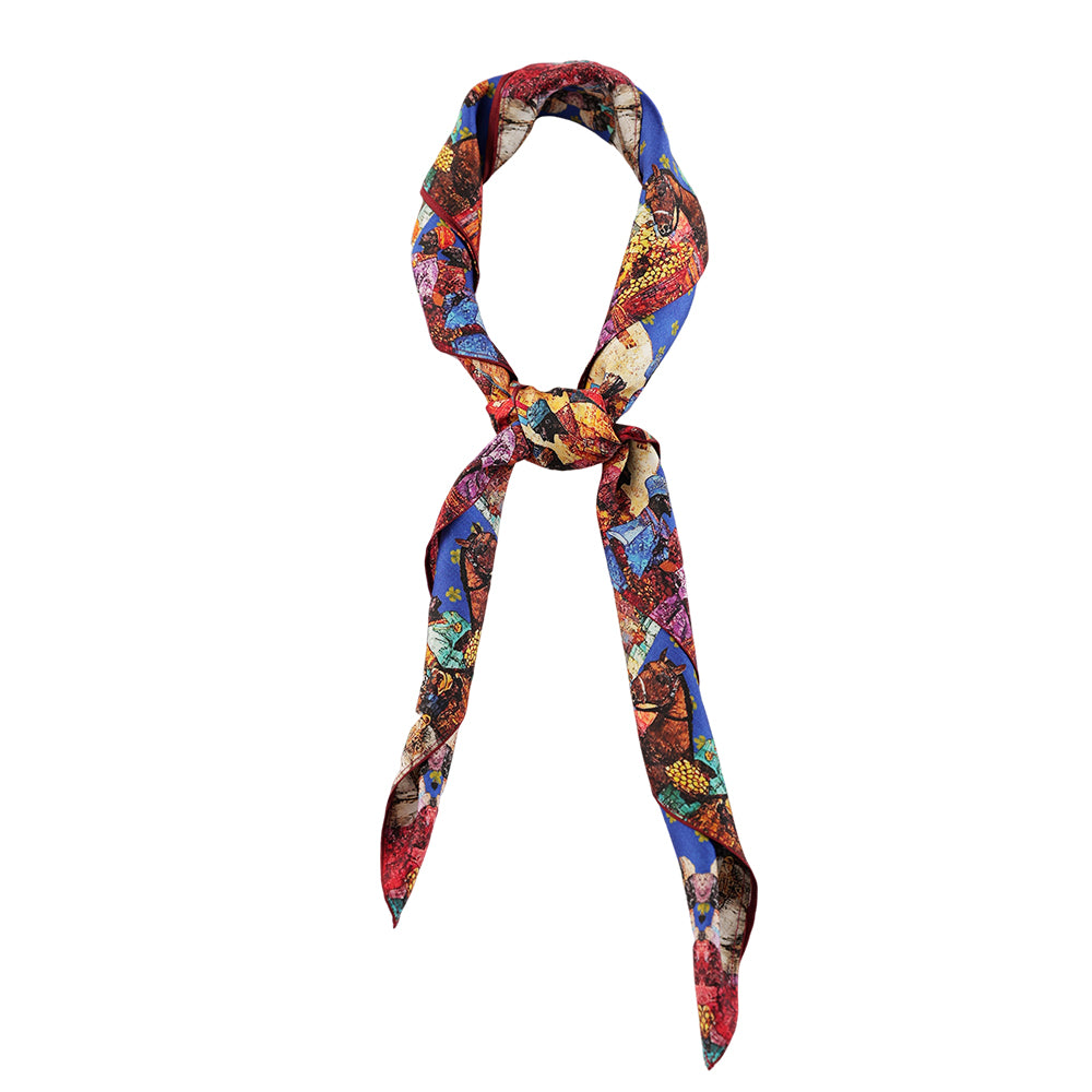 Colorful vintage art print silk scarf styled around the neck