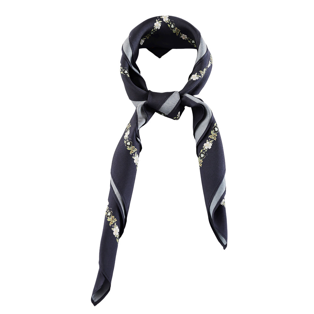 Navy paisley silk scarf styled around the neck