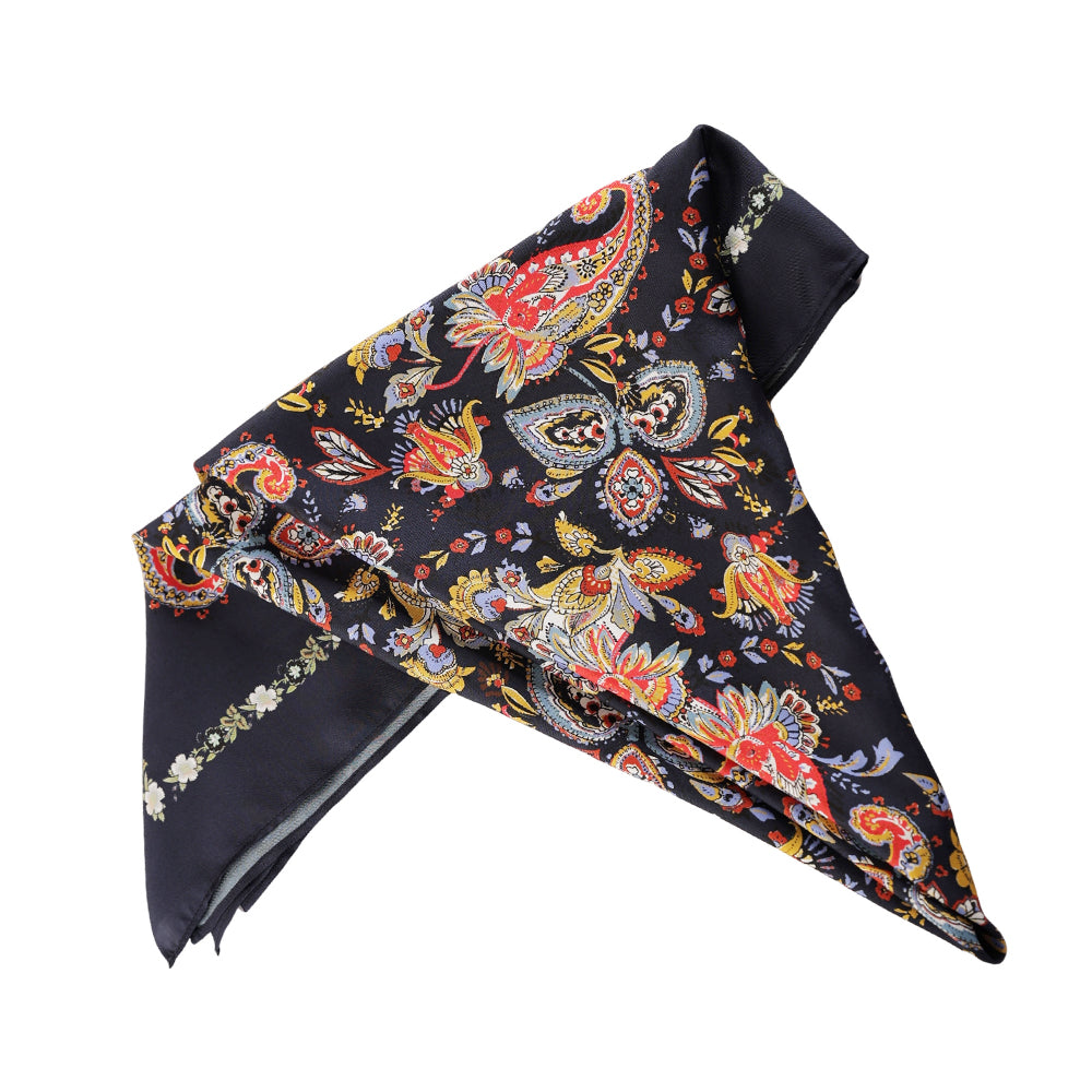 Draped styling of a navy colorful paisley silk scarf