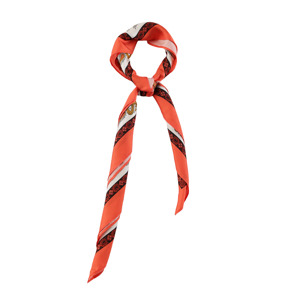 Orange paisley silk scarf styled around the neck