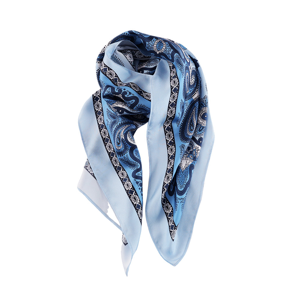 Draped styling of a light blue paisley silk scarf