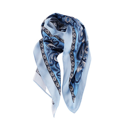 Draped styling of a light blue paisley silk scarf