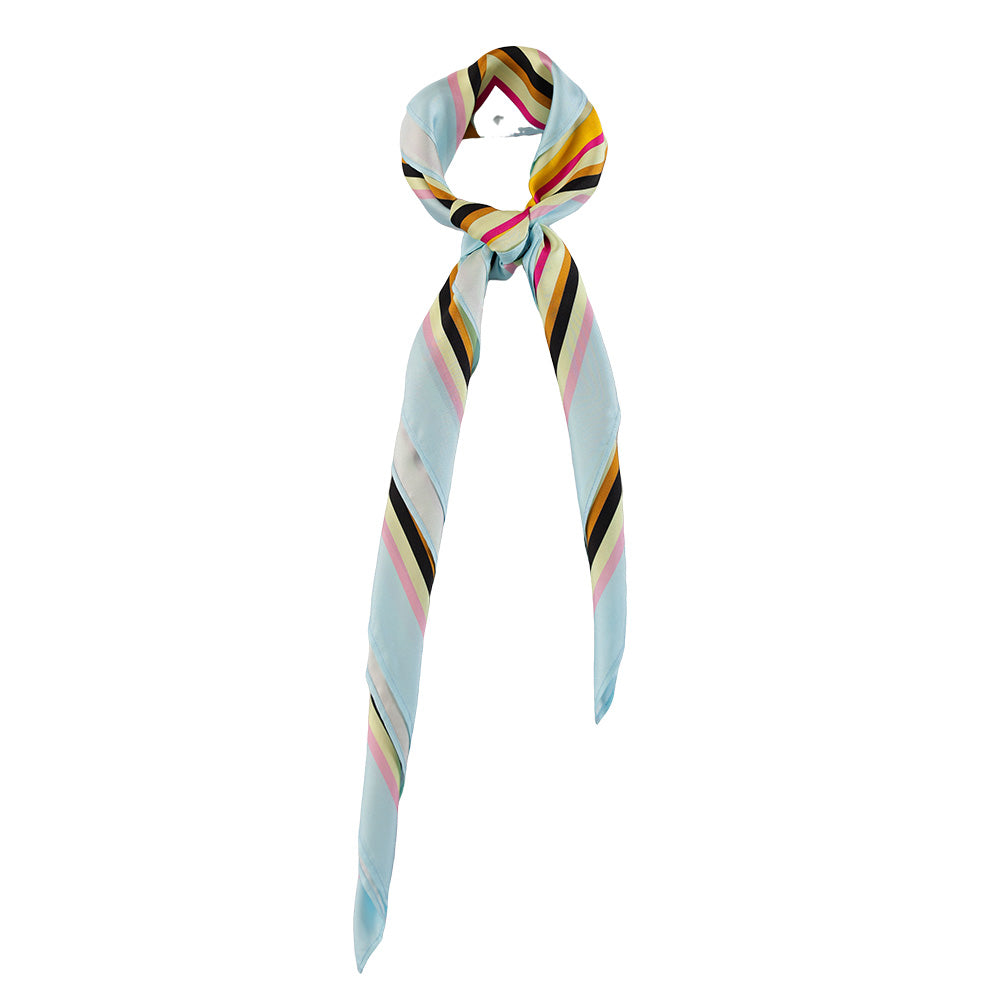 Colorful geometric print silk scarf styled around the neck