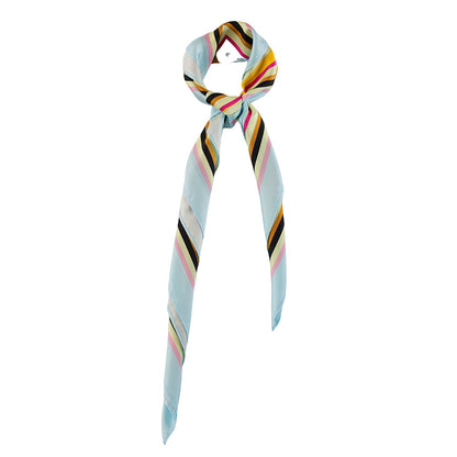 Colorful geometric print silk scarf styled around the neck