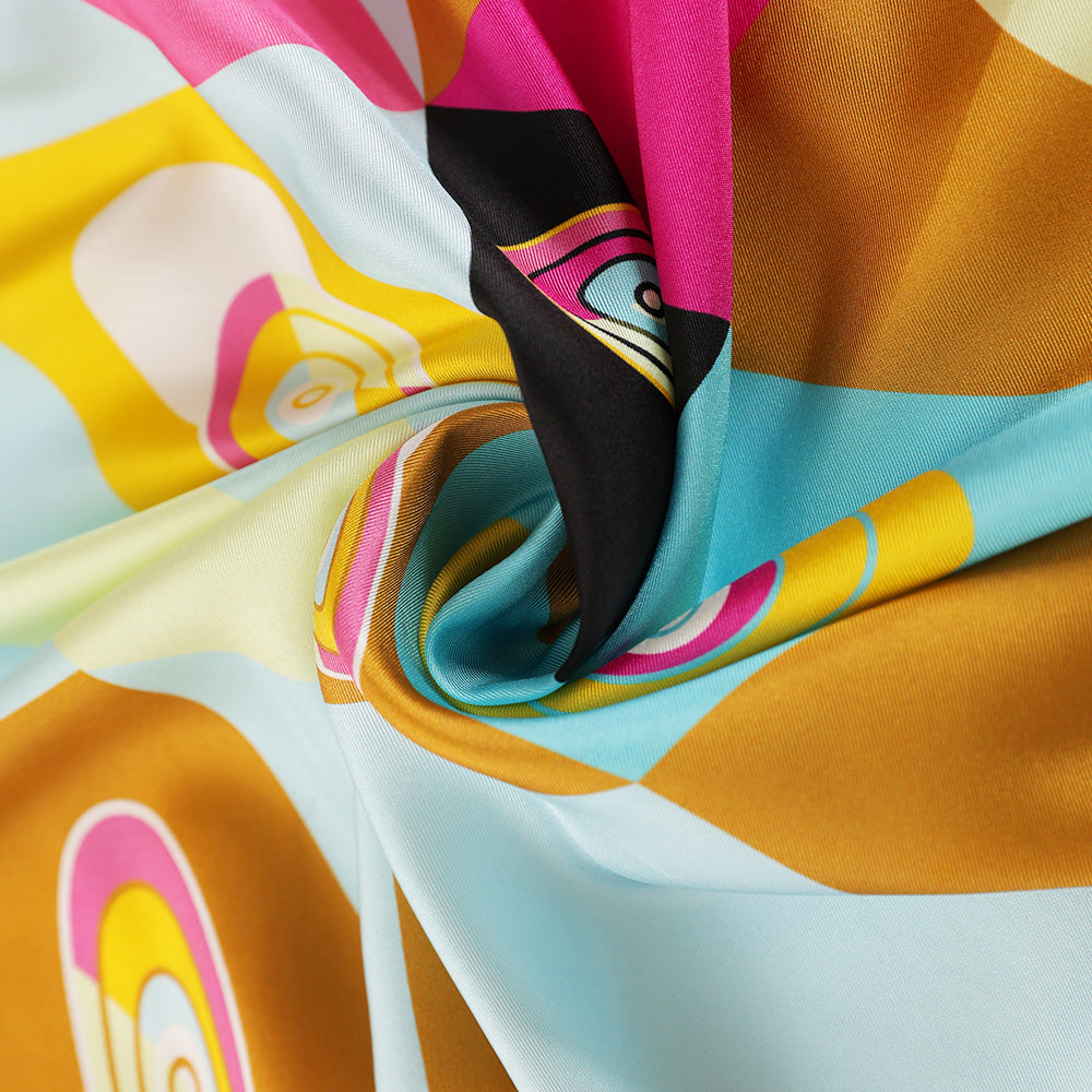 Close-up of the colorful geometric silk scarf print