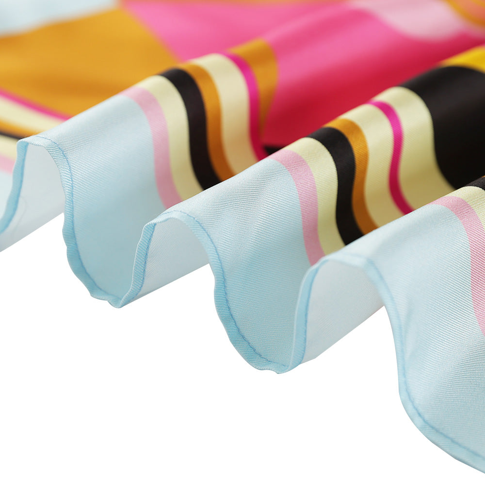 Close-up of the edge of the colorful silk scarf