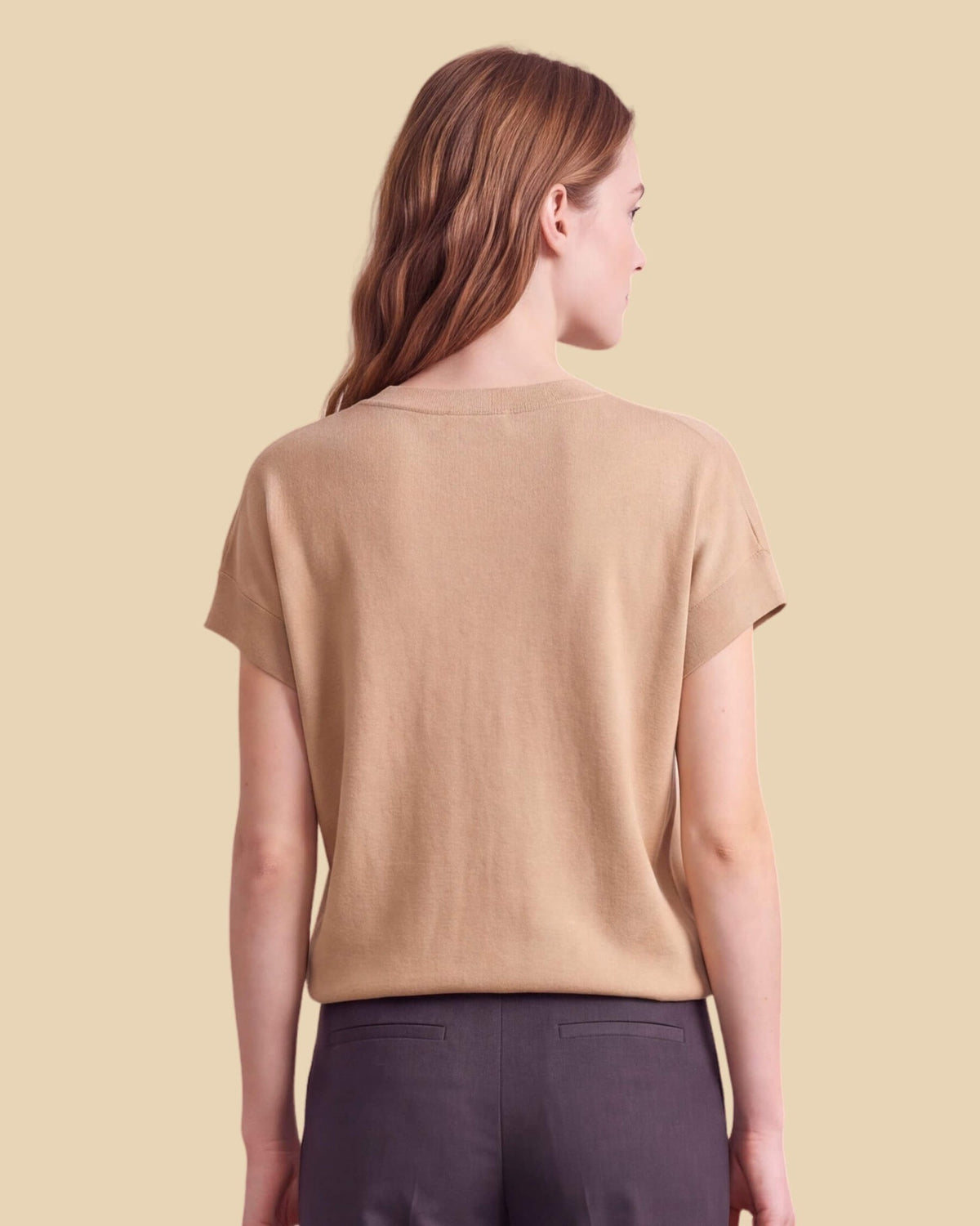 MoliSilk women's merino wool V-neck cap sleeve sweater in apricot, back view