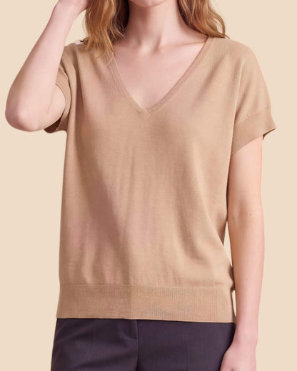MoliSilk women's merino wool V-neck cap sleeve sweater in apricot, V-neckline and knit detail close-up