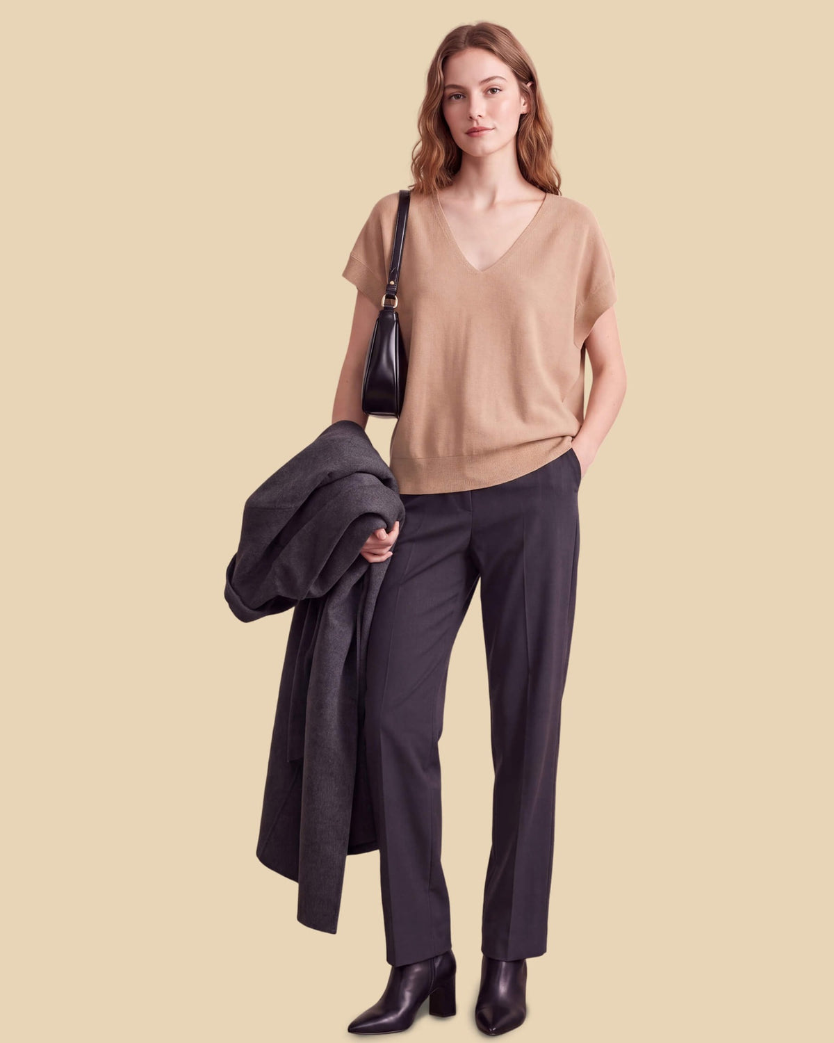 MoliSilk women's merino wool V-neck cap sleeve sweater in apricot, full outfit with tailored trousers