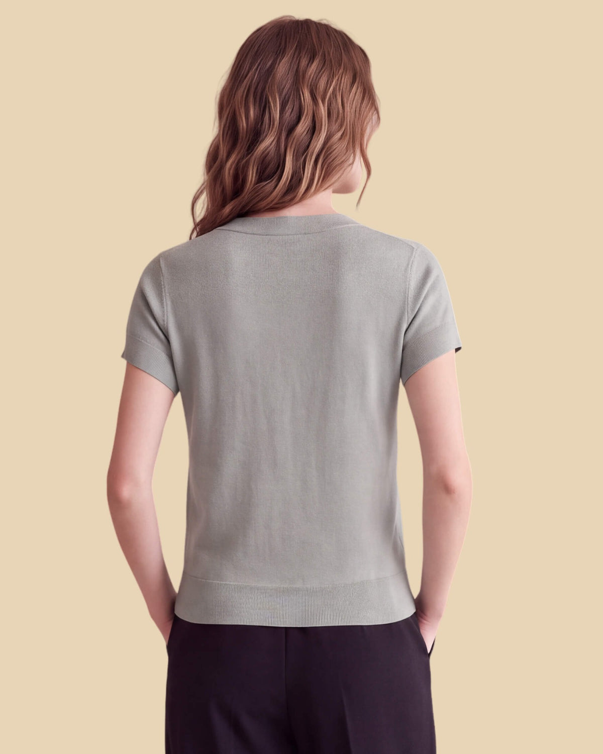 MoliSilk women's merino wool V-neck cap sleeve sweater in grass green, back view
