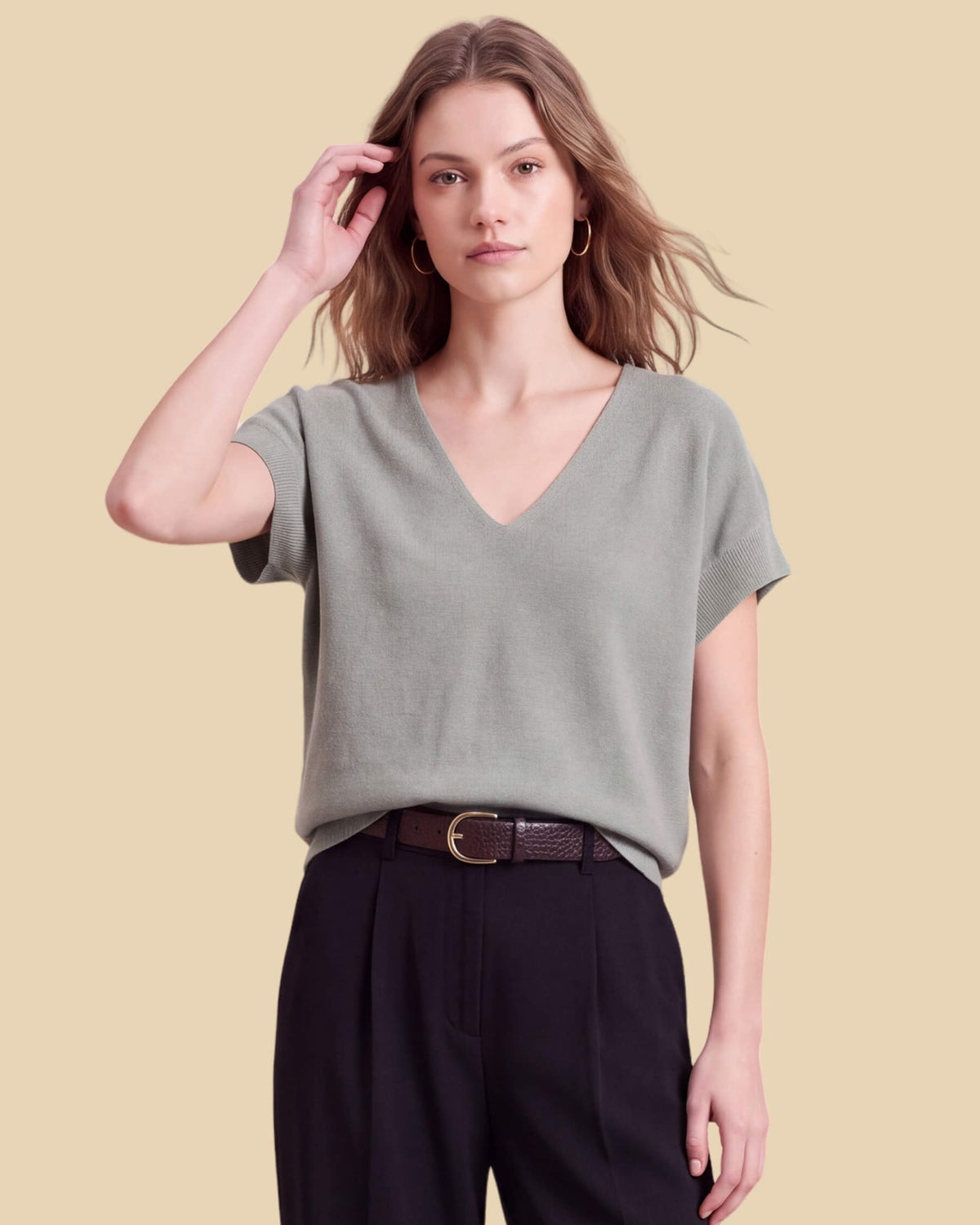 MoliSilk women's merino wool V-neck cap sleeve sweater in grass green, front view