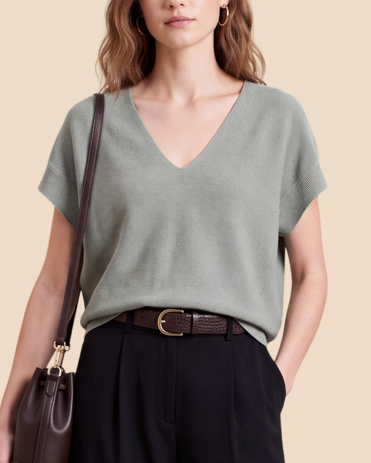 MoliSilk women's merino wool V-neck cap sleeve sweater in grass green, V-neckline and knit detail close-up