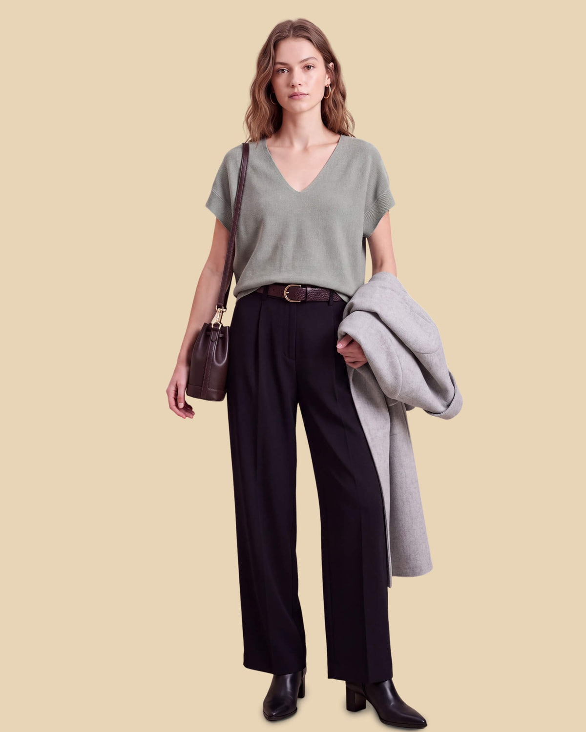 MoliSilk women's merino wool V-neck cap sleeve sweater in grass green, full outfit with tailored trousers